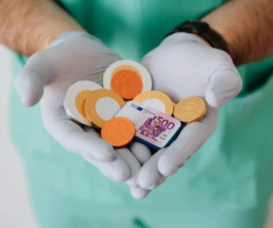 pexels-karolina-grabowska-4021809-ezgif.com-jpg-to-webp-converter Business owner confidently reviewing medical insurance quotes for their employees on a tablet.