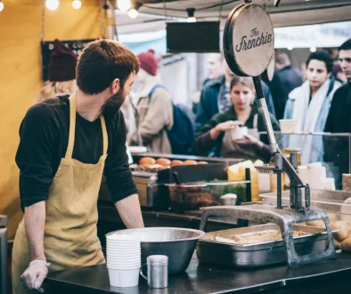 pexels-conojeghuo-375889-ezgif.com-jpg-to-webp-converter Wind turbines in a field, an example of a renewable source for business electricity.
